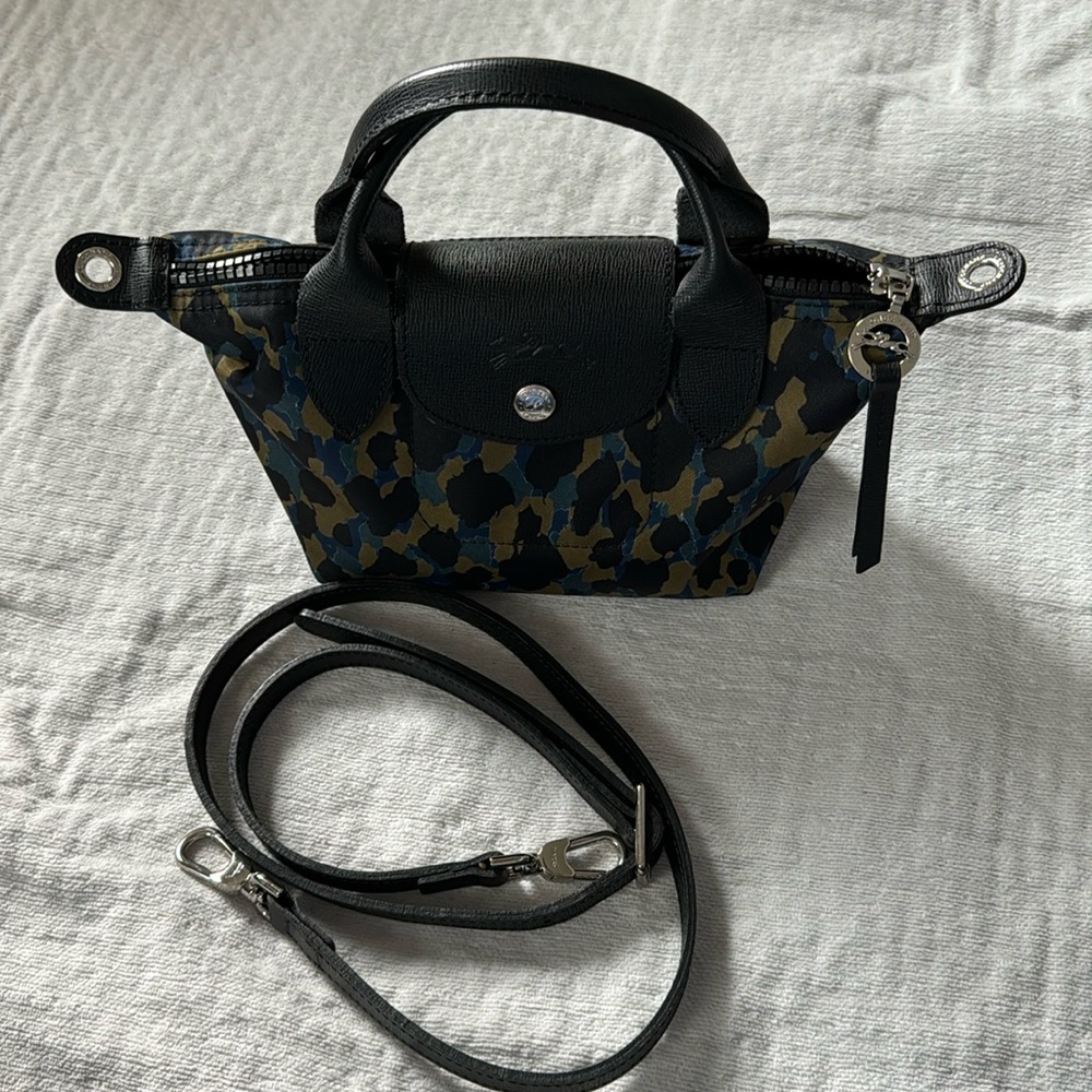 Authentic Longchamp Le Pliage Neo Extra Small with leather trim.